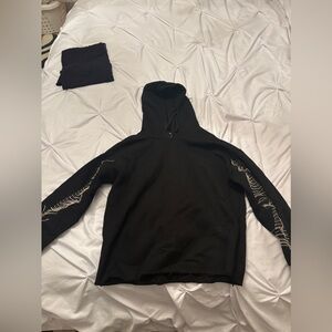 Bloomingdale’s AQUA black sweatshirt with fringe rhinestones on sleeves